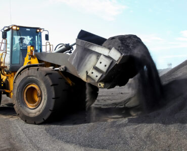 large-yellow-loader-moving-black-material-at-works-2026-03-18-16-05-44-utc
